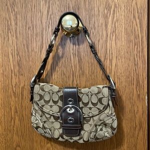 Coach Signature canvas brown & tan purse with leather strap.